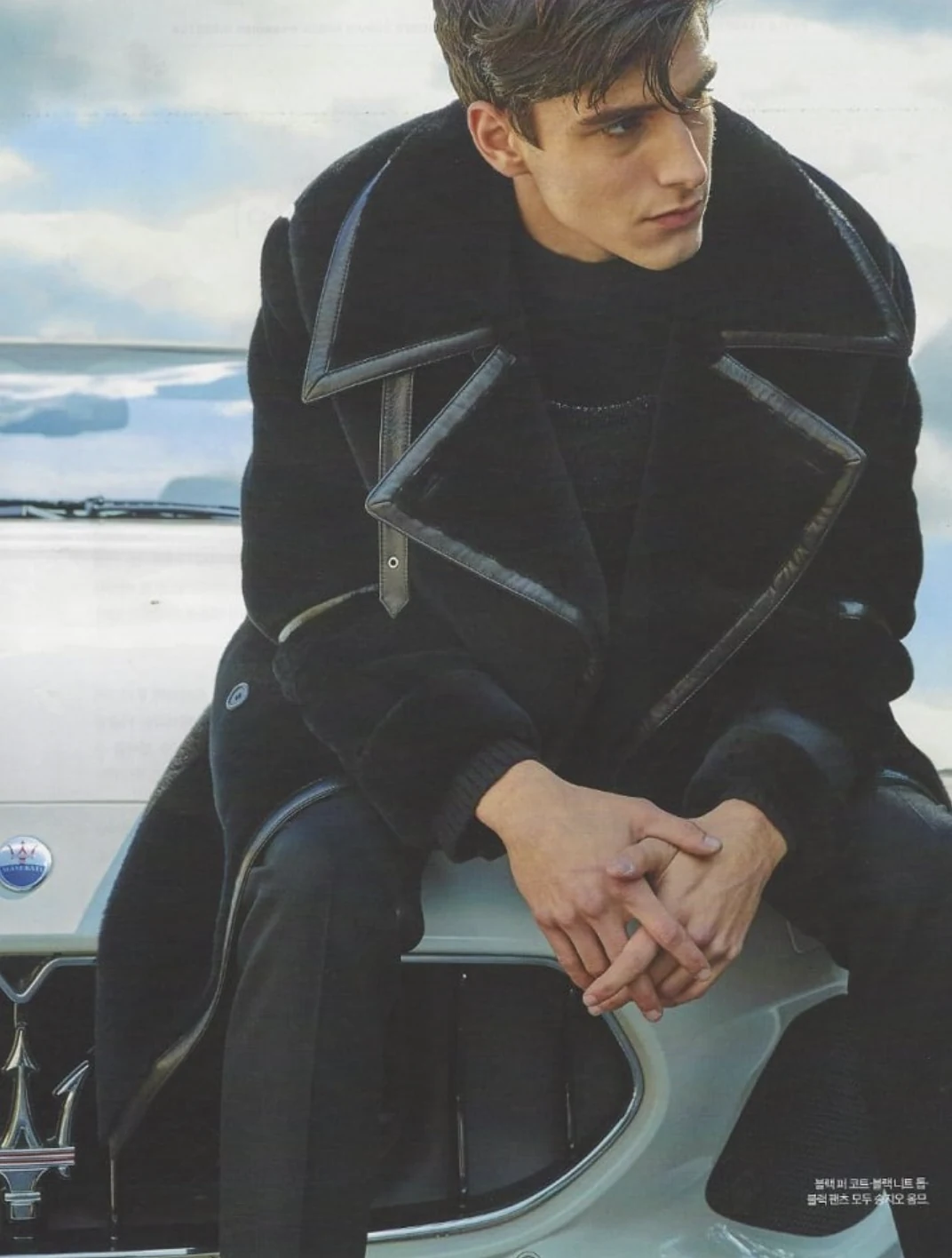 Luca Bold in a shearling coat seated on a Maserati — editorial for Forbes Magazine, South Korea, 2018